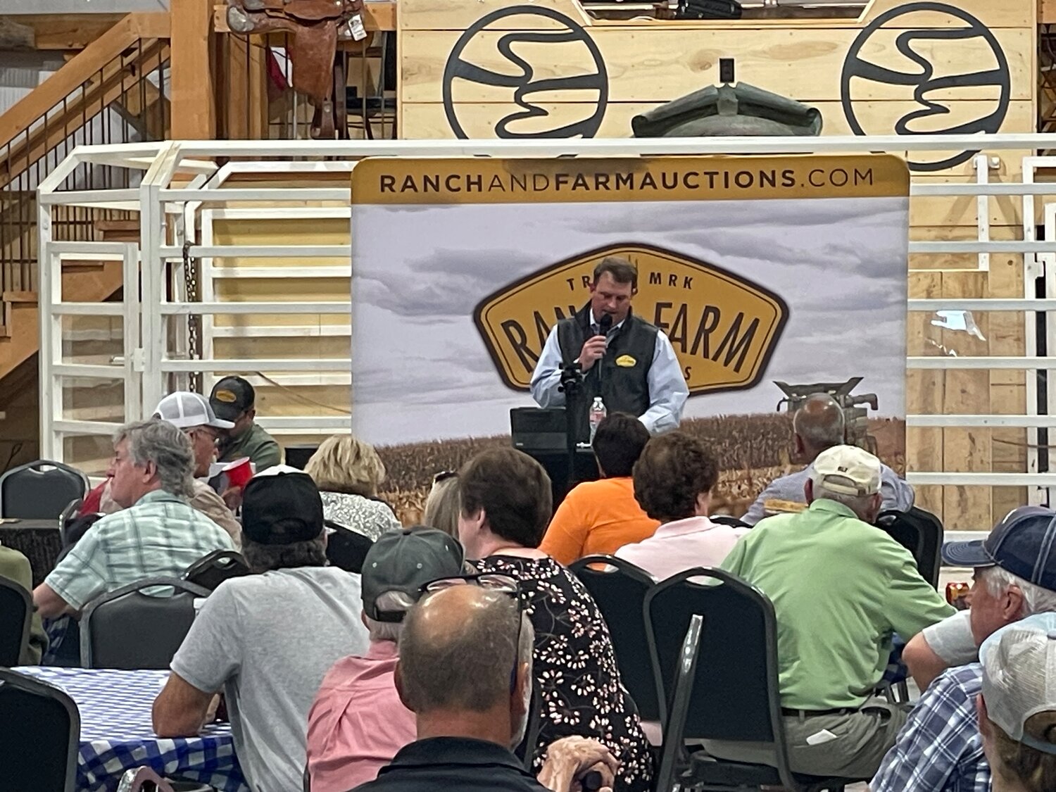 Auctioneer Cody Lowderman conducts a recent auction for land in far east Springfield.